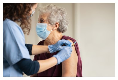 Photo of elderly woman receiving a vaccination